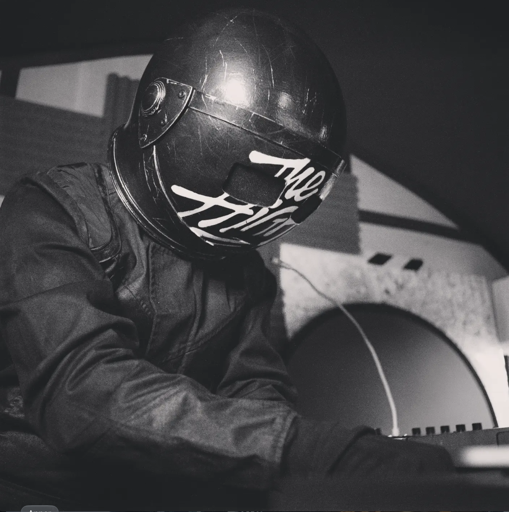 The High wearing a motorcycle helmet